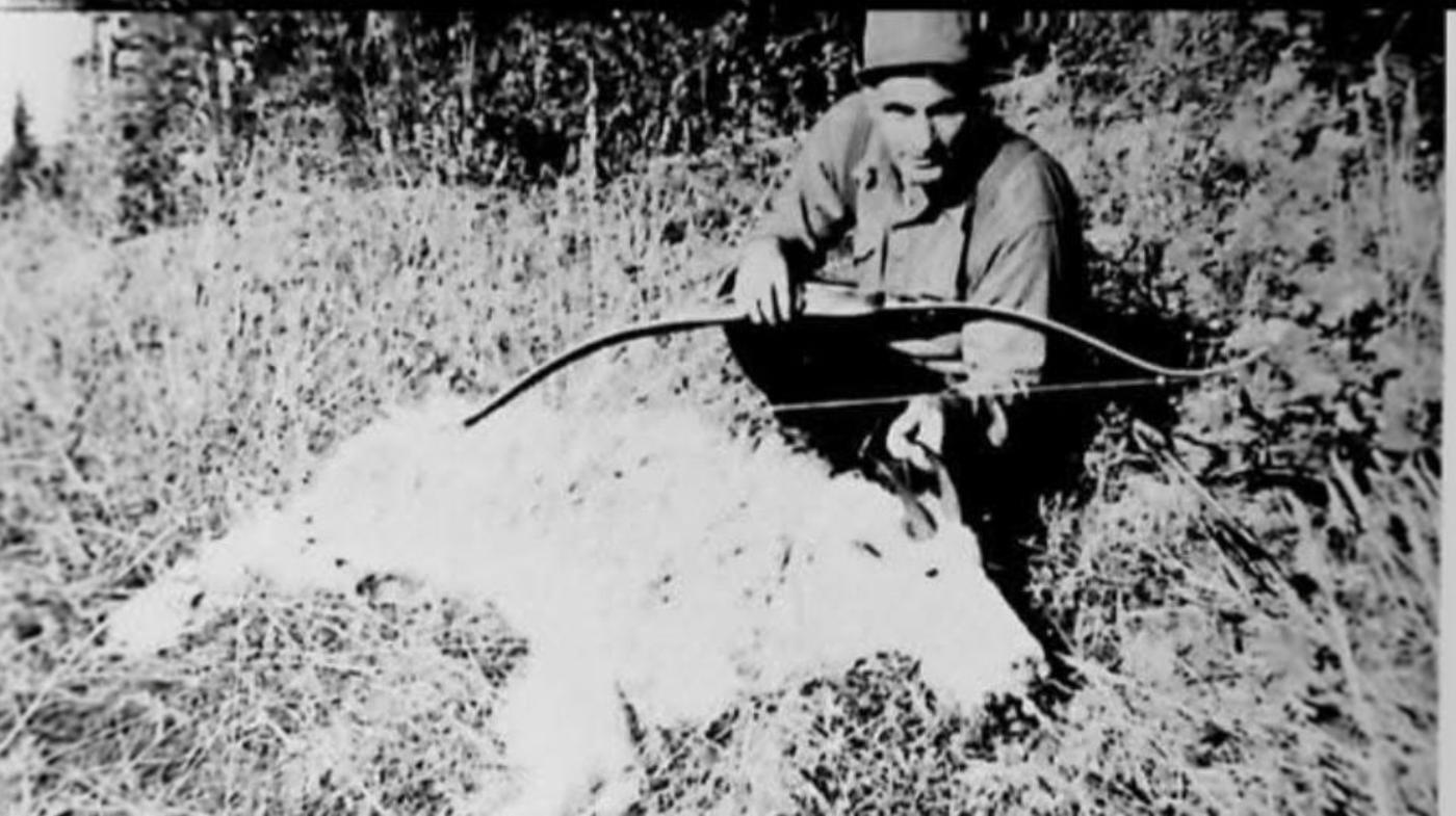 Jack Joy Whitney with mountain goat taken in Montana 1950s using traditional bow