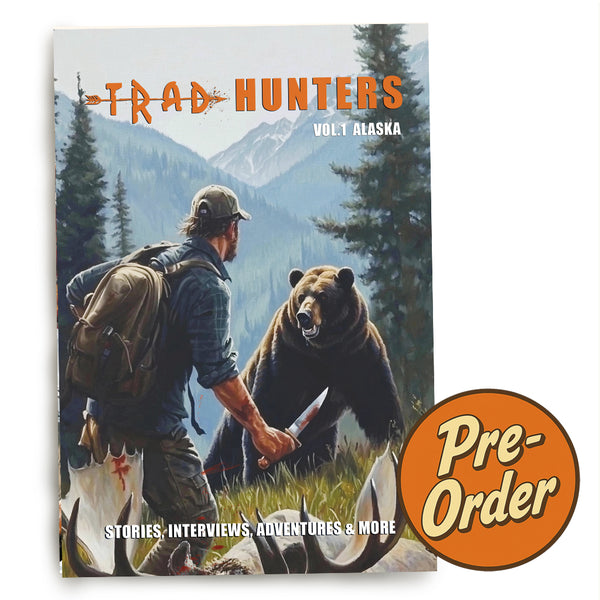 Trad Hunters Magazine Vol. 1 Alaska cover featuring a bowhunter facing a brown bear, 1950s-style hunting illustration